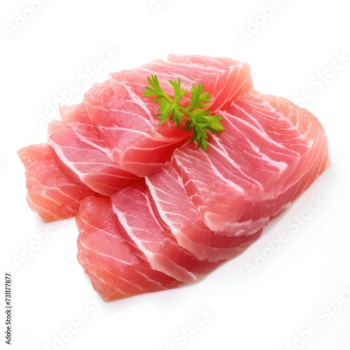 Fresh tuna fish fillet garnished with parsley isolated on white background. Tuna steak sliced for package, grocery product advert