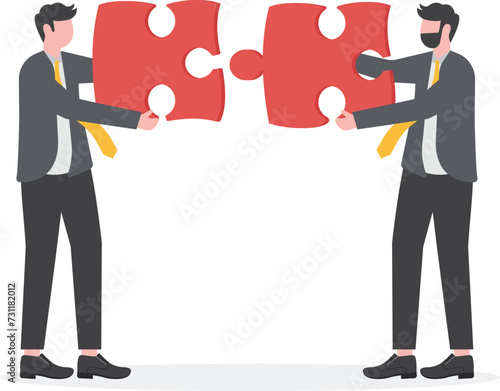 Partnership or teamwork. Two businessmen joining together large jigsaw puzzle pieces.
