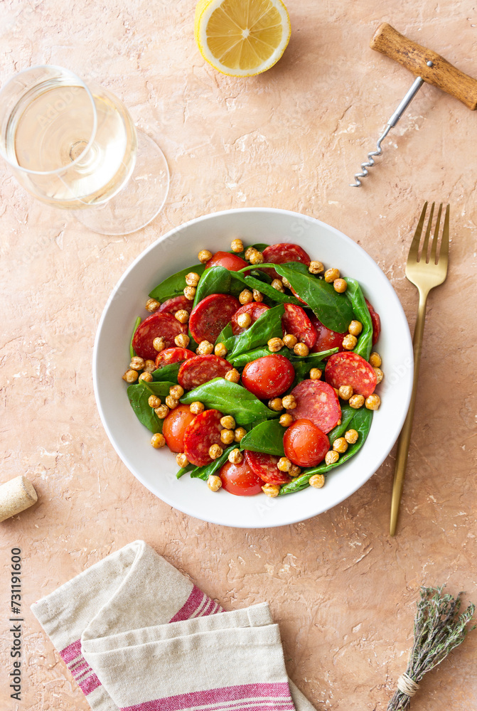 Salad with spinach, sausage, tomatoes and chickpeas. Healthy eating. Diet. Salad with spinach, sausage, tomatoes and chickpeas. Healthy eating. Diet.