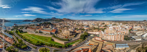 Aerial view of Cartagena port city in Spain surrounded by bastions and fortifications, medieval castle hill, roman amphitheater, bull ring,  photo
