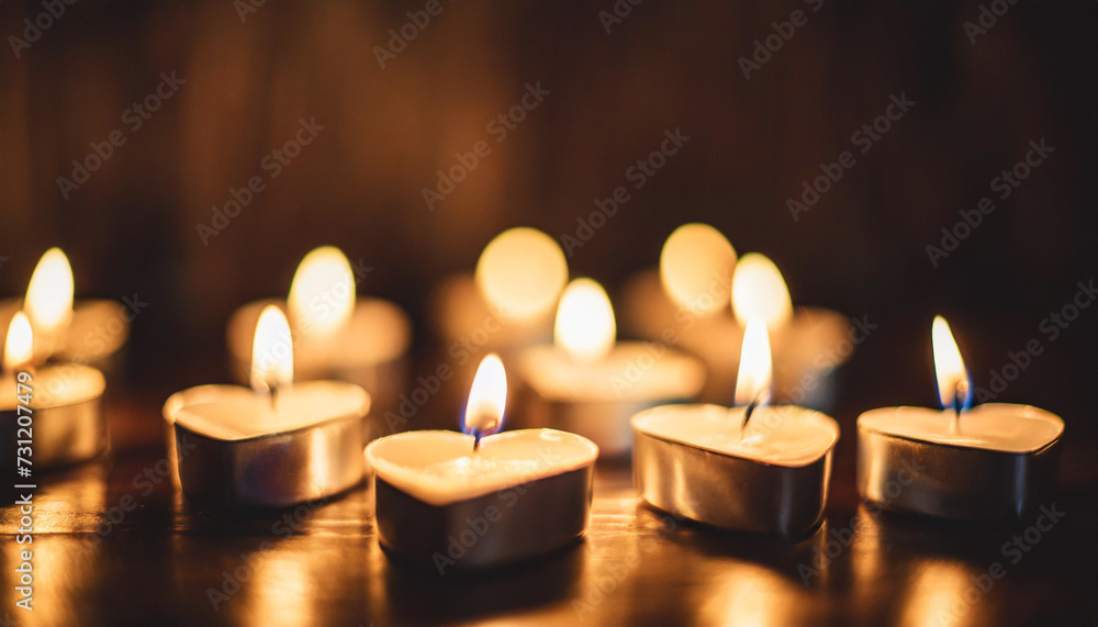 Heart-shaped candles aglow on dark backdrop, evoking romance and warmth. Ideal for Valentine's Day Heart-shaped candles aglow on dark backdrop, evoking romance and warmth. Ideal for Valentine's Day