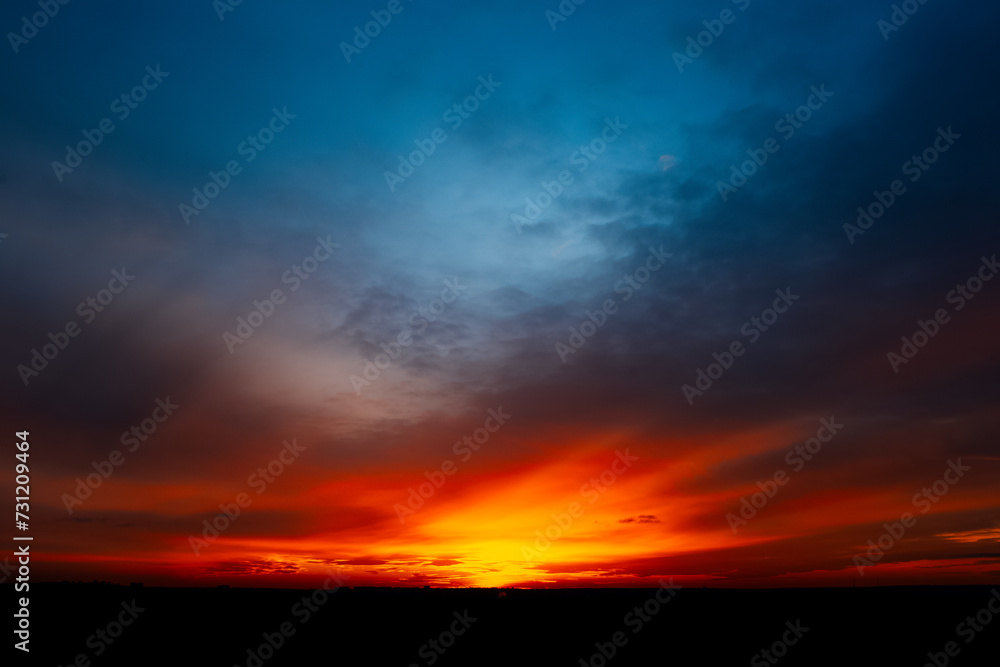 Beautiful landscape of colourful dark sunset or sunrise.