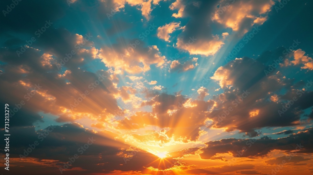 Sunset sky with sun rays and sunset clouds