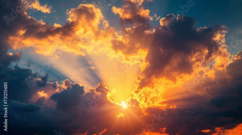 Sunset sky with sun rays and sunset clouds © Ahtesham
