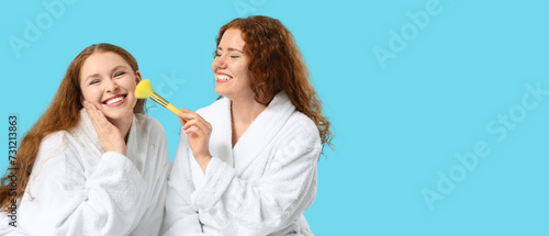 Happy redhead women in bath...