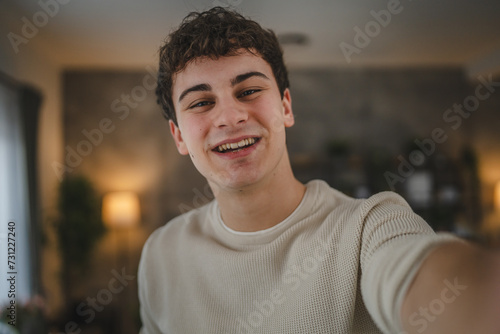 Portrait of teenage boy caucasian teen male young man stand at home