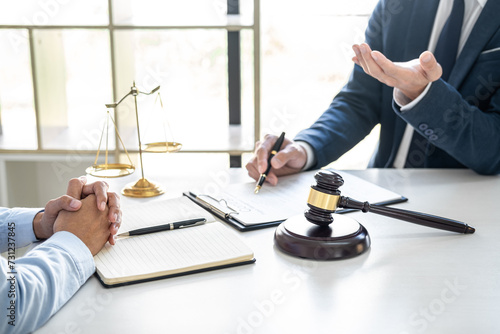 Consultation and conference of Male lawyers and professional businesswoman working and discussion having at law firm in office. Concepts of law, Judge gavel with scales of justice