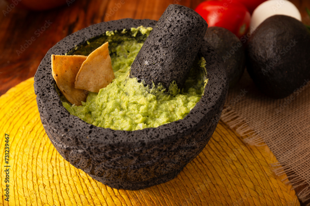 Guacamole. Avocado dip with tortilla chips also called Nachos served in