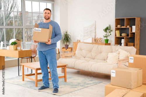 Young man with open parcel ...