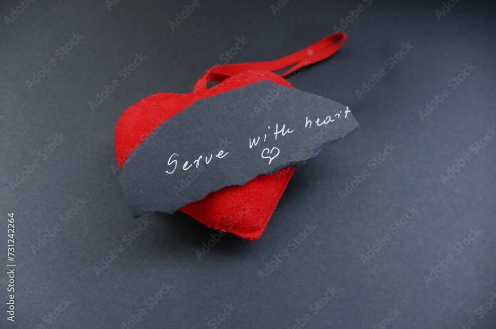 Serve with heart - heart and note with handwriting text - obrazy, fototapety, plakaty 