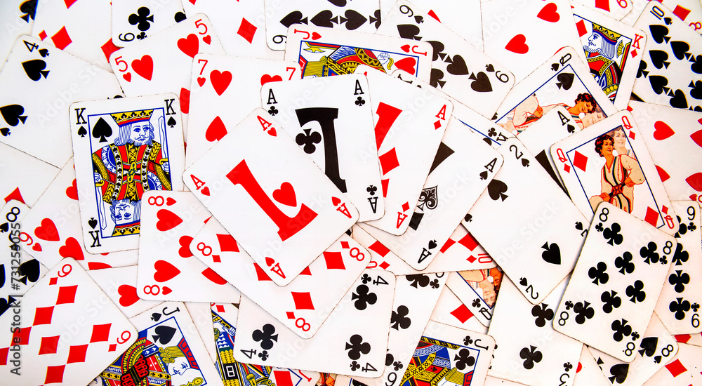 Poker of Aces. Card games. Zenithal view on French-suited decks. Background and backdrop with poker cards for casino and gambling games. Ideal for texture and pattern. Poker of Aces. Card games. Zenithal view on French-suited decks. Background and backdrop with poker cards for casino and gambling games. Ideal for texture and pattern.
