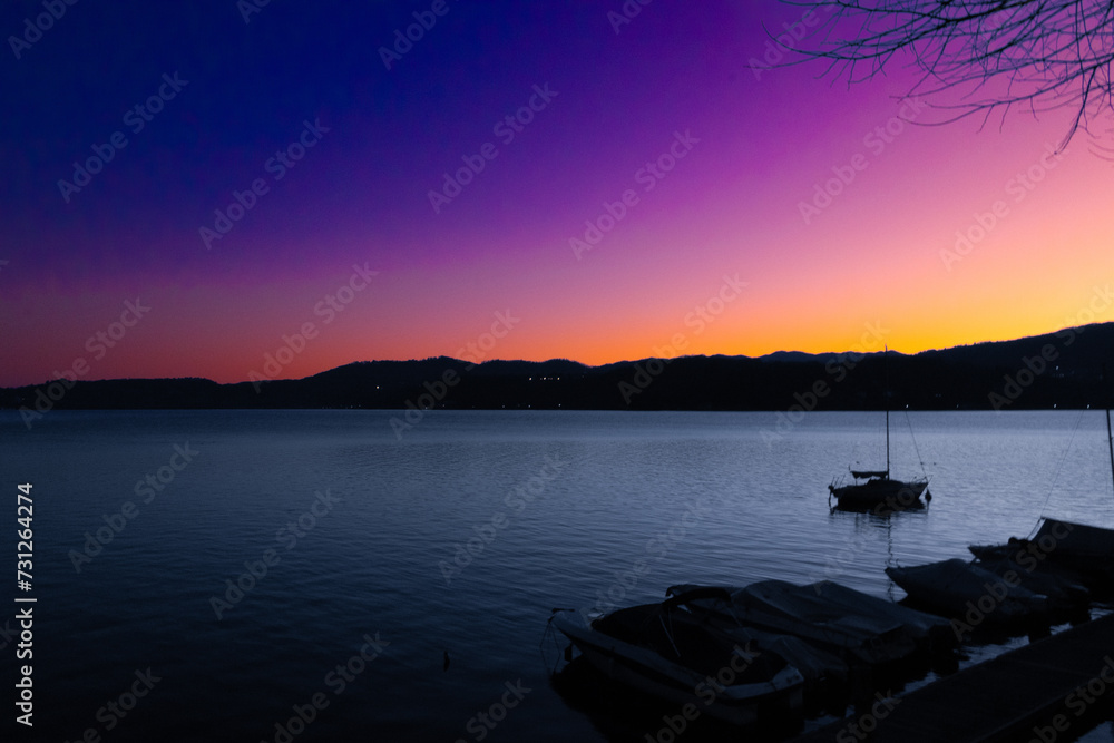Charming view of the lake at dusk, in a coloured atmosphere.