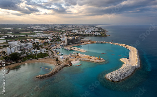 Drone aerial scenery of marina under construction at sunset. Paralimni fishing port Protaras Cyprus