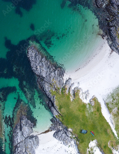 Blue , transparent and clear water Scotland uk near Arisaig Scottish Highlands beautiful white sandy beach Scottish tourist destination located south of Mallaig. Camping spot
