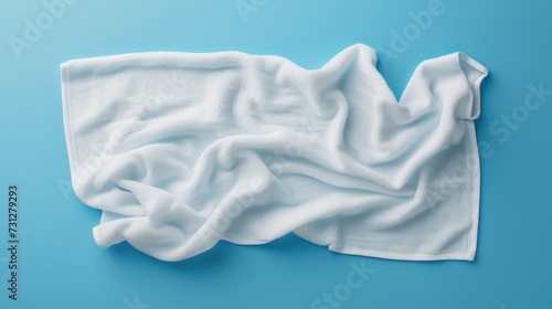 Generating a white beach towel mockup isolated with a clipping path on a blue background in a flat lay top view style