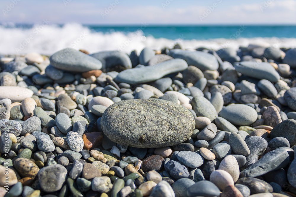 Beach stones and pebbles in front of the sea and sky Beach stones and pebbles in front of the sea and sky