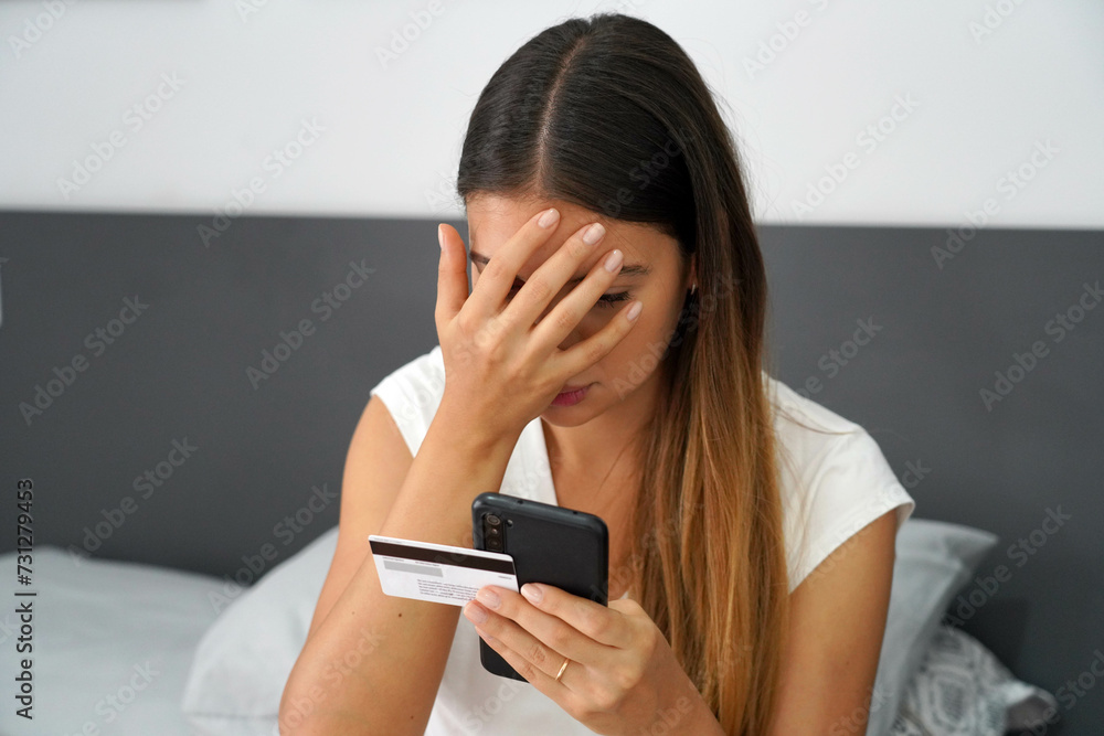 Digital theft. Desperate girl finds out that her credit card was cloned and her bank account emptied. Cyber security concept. Digital theft. Desperate girl finds out that her credit card was cloned and her bank account emptied. Cyber security concept.