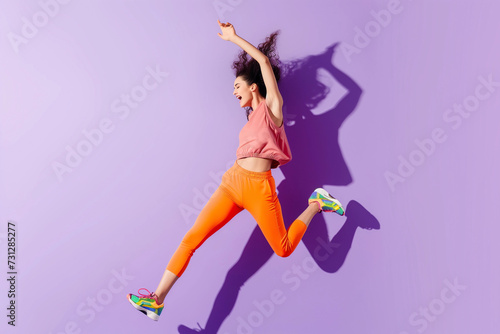 a whole body studio shot of a young woman in bright colored fitness outfit with colorful sneakers on a bright pale purple studio minimalist background
