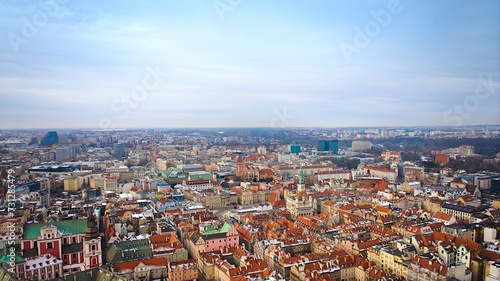 Aerial view of Poznań's historic market square in winter, showcasing the charming old townhouses adjacent to the square.