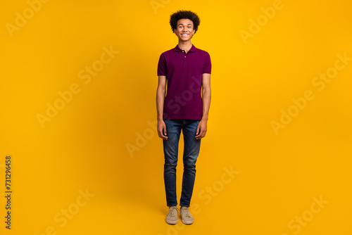 Full length photo of positive optimistic man wear violet outfit isolated on yellow color background