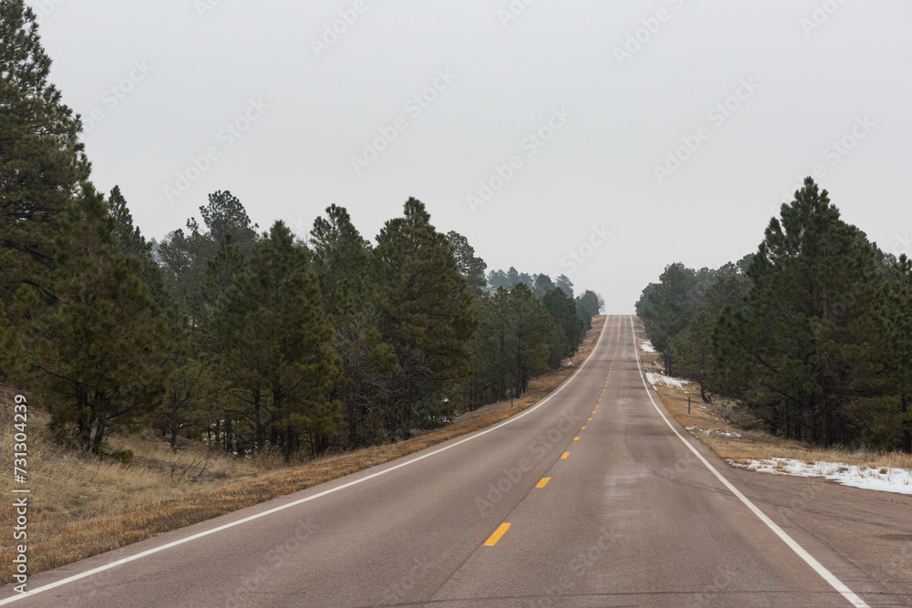 Open road in Eastern Colorado, approaching the Rockies.  December.  