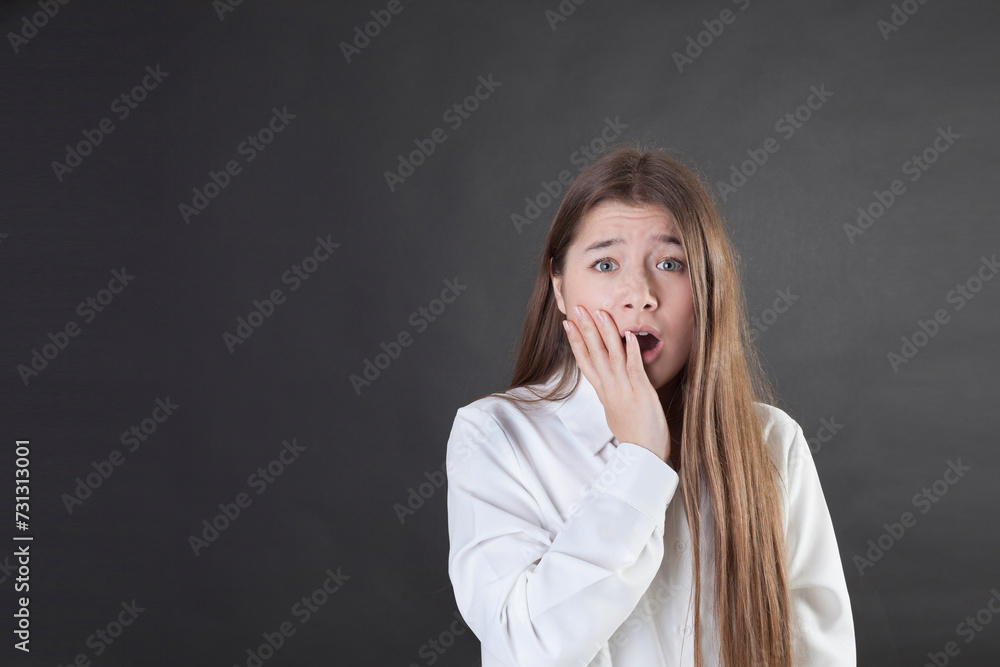 Beautiful young woman, portrait of an unpleasantly surprised woman.
copy space Beautiful young woman, portrait of an unpleasantly surprised woman.
copy space
