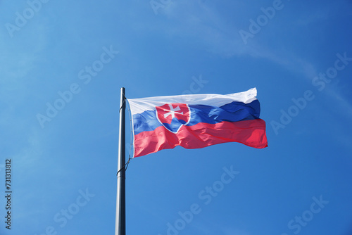 The flag of Slovakia hangs on the mast