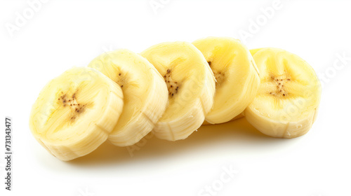 This image captures the freshness and appeal of ripe bananas, with a whole fruit and its slices beautifully isolated against a white backdrop.