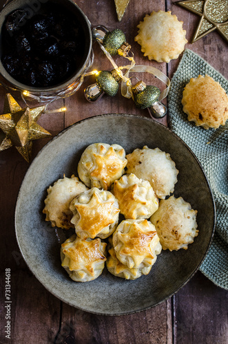 Puff Pastry apetizers with dried plum and italian ham, called Speck. photo