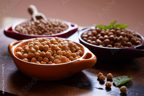 Trio of dried, cooked and roasted high fiber, protein rich legume, garbanzo beans commonly known as chickpeas. photo