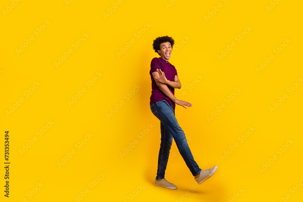 Full length photo of cheerful funny good mood guy wear stylish violet clothes dancing cool party isolated on yellow color background