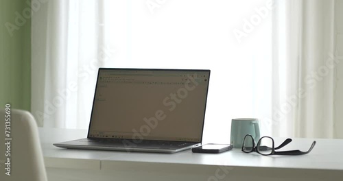 Wallpaper Mural Work laptop at home next to a cup of coffee. Torontodigital.ca