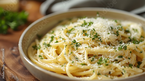 A bowl of creamy pasta, with a flavorful sauce and a topping of grated Parmesan cheese.