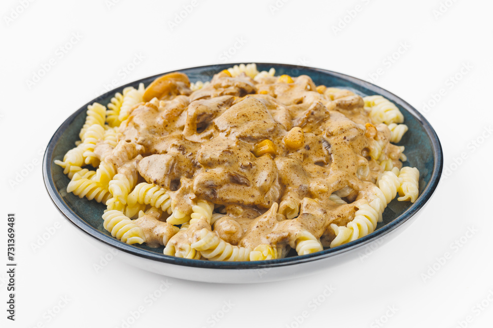pasta with meat and cream sauce on a plate on a white background pasta with meat and cream sauce on a plate on a white background