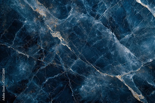 A striking dark blue marble background with copy space, evoking a sense of sophistication, luxury, and timeless elegance