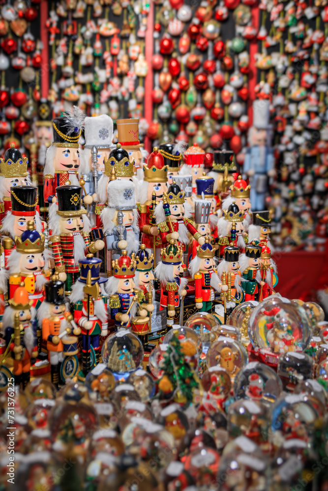 Display full of colorful Christmas ornaments and toys for sale at a souvenir shop in the old town in Strasbourg, France