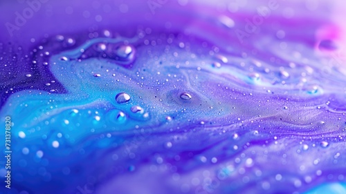 Vivid purple and blue abstract fluid art with glistening water droplets