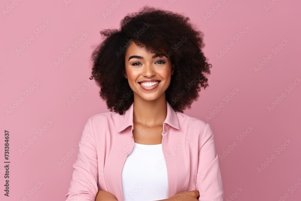 Portrait of beautiful young african american woman with curly hair smiling at camera Portrait of beautiful young african american woman with curly hair smiling at camera