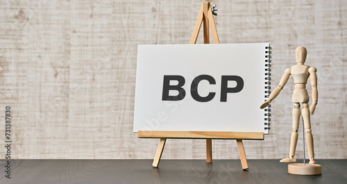 There is notebook with the word BCP. It is an abbreviation for Business Continuity Plan as eye-catching image. photo