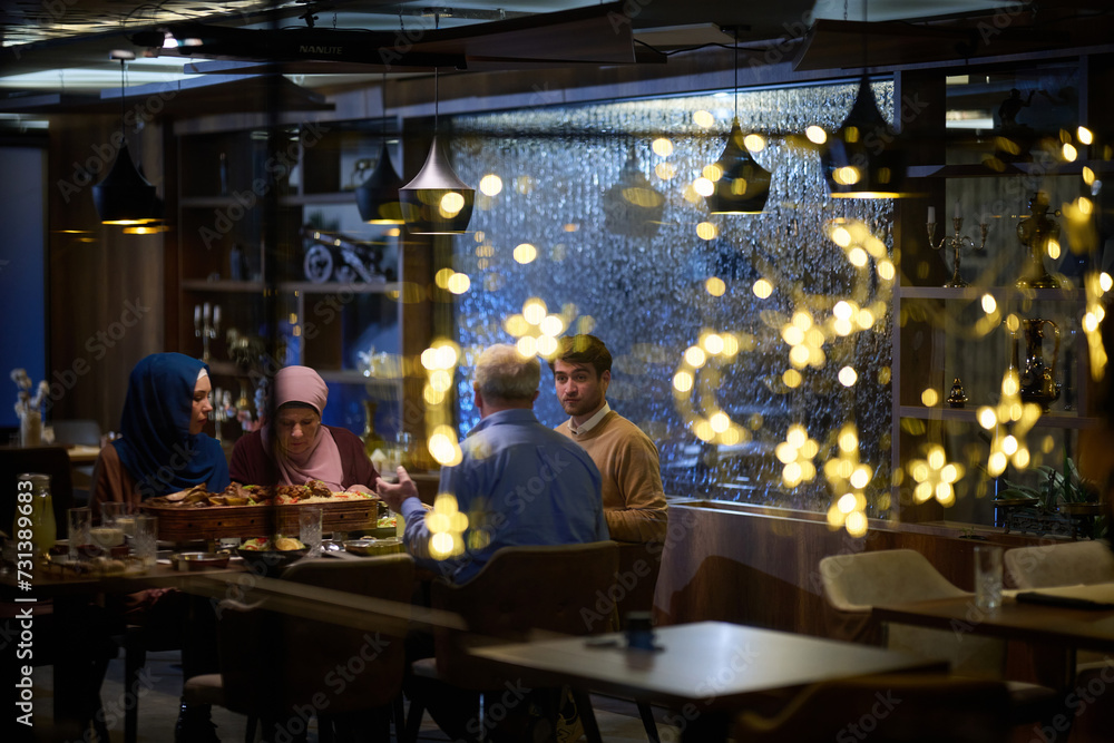A modern and traditional European Islamic family comes together for iftar in a contemporary restaurant during the Ramadan fasting period, embodying cultural harmony and familial unity amidst a
