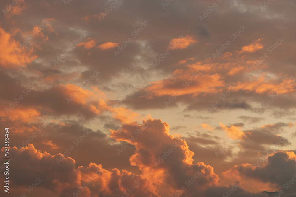 Orange Sunset background with different textures and colors in the clouds.