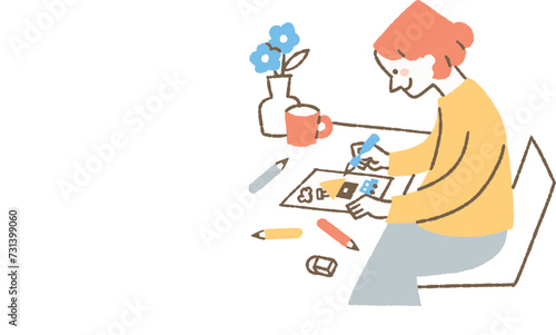 自宅でイラストを描いている女性_色