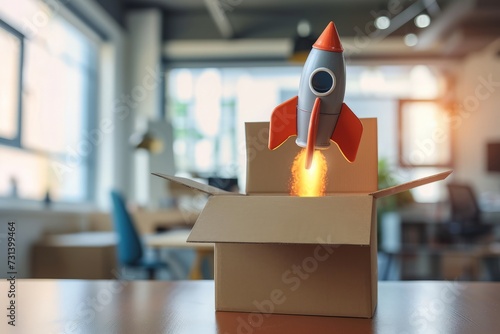 Rocket flying out of a cardboard box on an office table