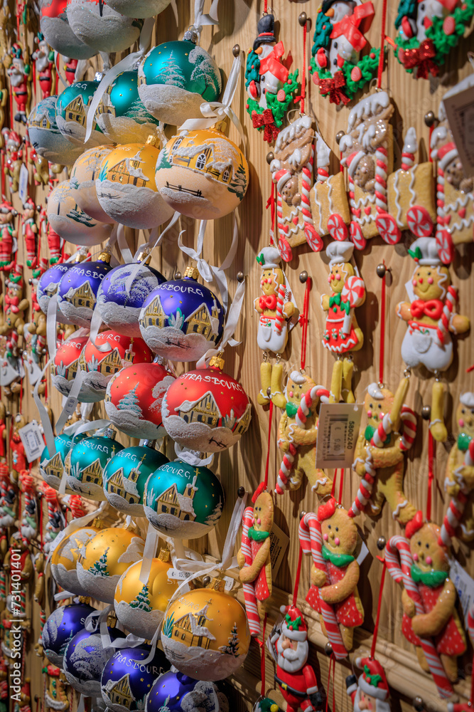 Display full of colorful Christmas ornaments and toys for sale at a souvenir shop in the old town in Strasbourg, France