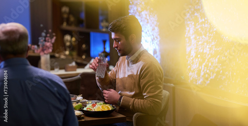 Fotografie A son and his elderly father engage in heartfelt conversation while patiently a
