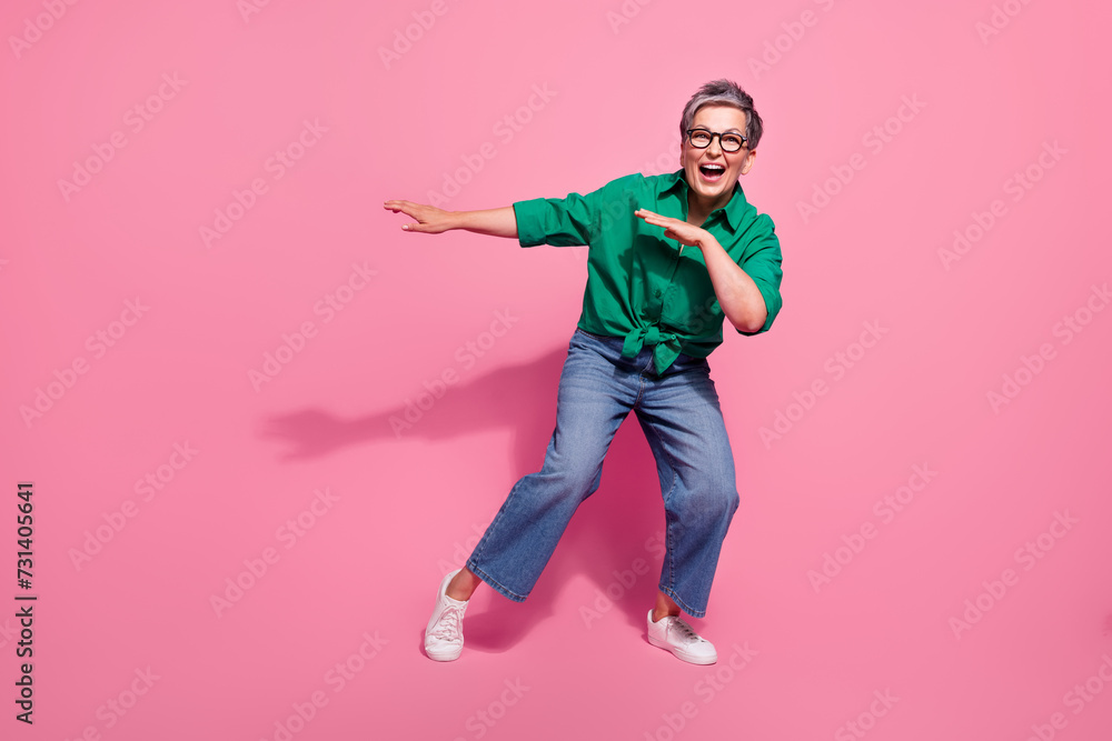 Full size photo of pretty retired female dance bachelorette party have fun dressed stylish green outfit isolated on pink color background