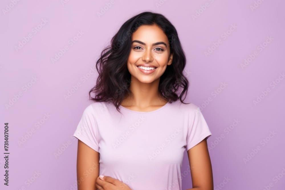 Portrait of happy smiling young woman in casual clothes, over violet background Portrait of happy smiling young woman in casual clothes, over violet background
