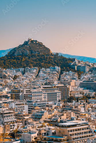Athens surrounding a hill at sunset