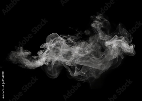 smoke floating in the air on a black background