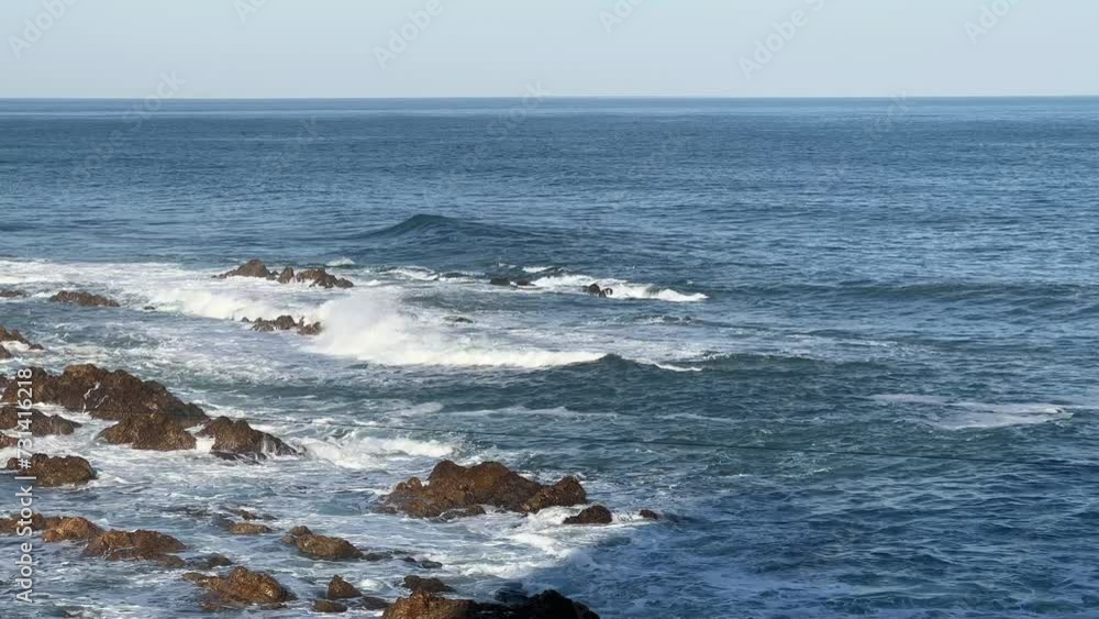 Waves smashing over sea boulders Waves smashing over sea boulders